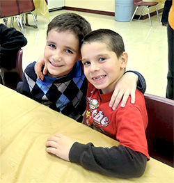 Two male students with their arms over each others shoulders - Private Special Education, social skills, Bloomfield NJ