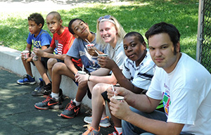 teacher and students eating ice cream sitting on the curb - Private Special Education, Bloomfield NJ