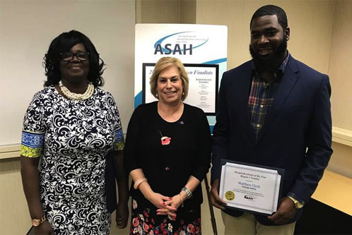 Matthew Clerk, right, is named ASAH Paraprofessional of the Year for ASAH Region I