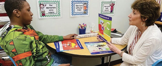 Speech Language Specialist Cheryl Jones working with a student in her office
